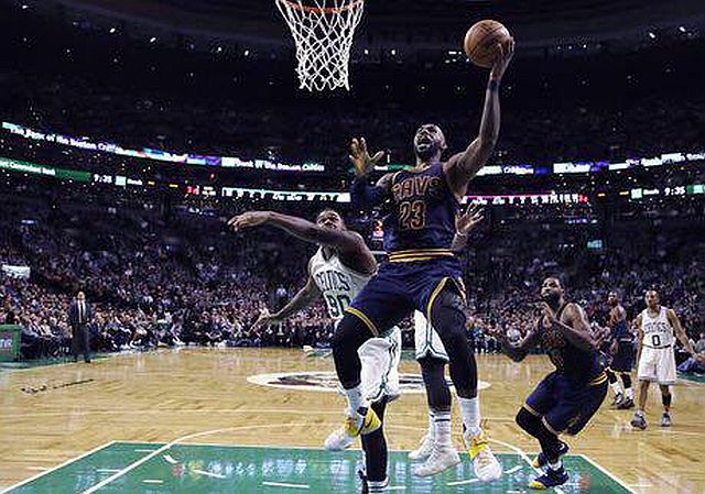 Cleveland Cavaliers forward LeBron James (23) drives to the basket past Boston Celtics forward Amir Johnson in Game 1 of the Eastern Conference Finals. (AP)