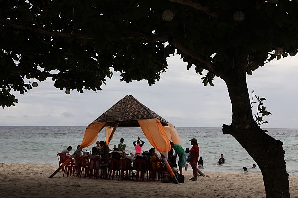 Local tourists chase the remaining days of summer at a public beach in Anda, Bohol, which is popular for its fine white sand.  (CDN PHOTO/TONEE DESPOJO