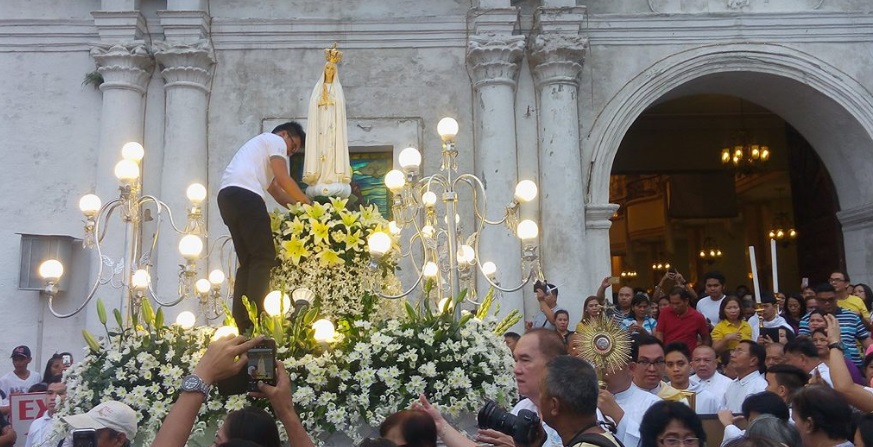 An image of the Our Lady of Fatima is brought out in a procession at the Cebu Metropolitan Cathedral in downtown Cebu City to mark the 100th anniversary of the apparition of Blessed Virgin Mary to three shepherd children at the Cova da Iria, in Fátima, Portugal.  (CDN PHOTO/ADOR VINCENT S. MAYOL)
