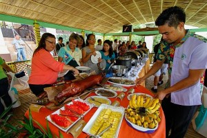 BOHOL LUBOC RIVER RELAUNCH/OCTOBER 24, 2013: Tourists are enjoying the buffet meal inside the Bohol floating resto and river cruise during its re-launching at the Loboc tourism complex in Loboc, Bohol.(CDN PHOTO/CHOY ROMANO)