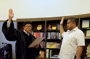 Ian Christopher Escario takes his oath of office before Court of Appeals Presiding Justice Andres Reyes Jr., after his proclamation as Bantayan town mayor. Contributed photos from Teena Escario-Gierran