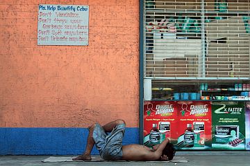 A homeless man sleeps on the sidewalk in Cebu City in this 2016 photo. cdn file photo A homeless man took a nap along the street of Boromeo, Sancianco yesterday morning while a steet sign shows "Pls. Help Beautify Cebu" (CDN PHOTO/FERDINAND R. EDRALIN) (CDN PHOTO/FERDINAND R. EDRALIN)