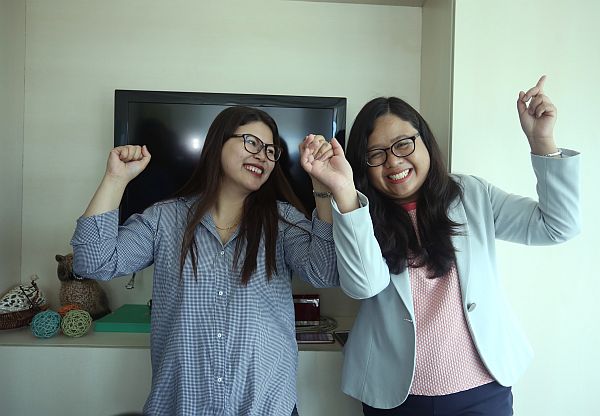 CELEBRATION: Bar topnotchers Karen Mae Calam Bar passer number 1 (left) and Anne Margaret Momongan number 7 celebrates after hearing they top on the bar exames at their office in SGV accounting firms. The two bar topnotchers studies their law at the University of San Carlos. (CDN PHOTO/LITO TECSON)