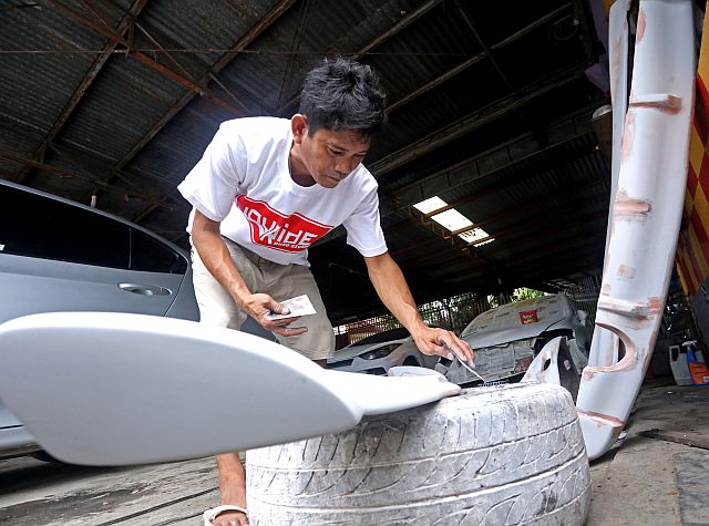 One of his employees works on a bodykit. 