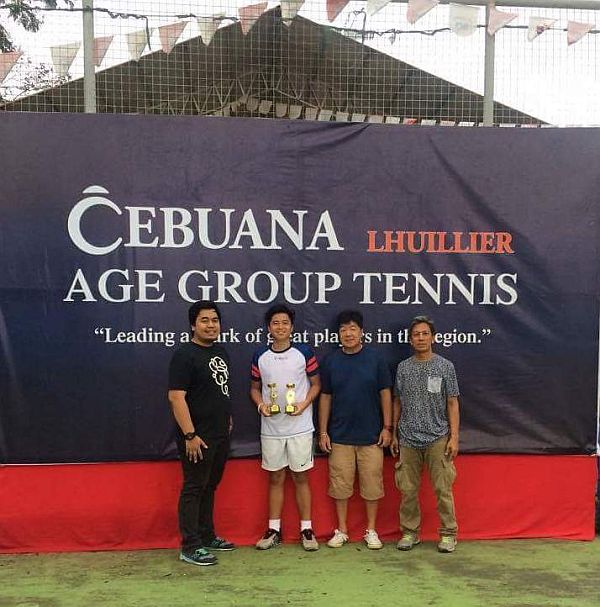 Suson (second from left) with tournament officials during the awarding of the Ubay, Bohol leg of the Cebuana Lhuillier age-group tournament.  cdn file