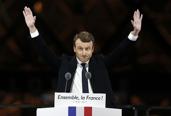French President-elect Emmanuel Macron gestures during a victory celebration outside the Louvre museum in Paris, France, Sunday. /AP