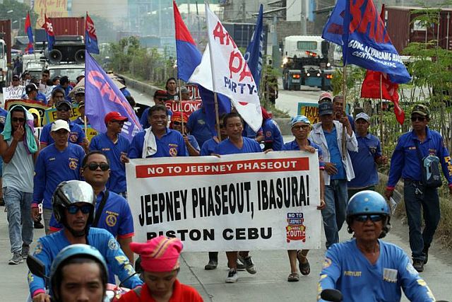 In this 2017 photo, members of Piston Cebu stage a rally protesting the plan to phase out of jeepney units that were at least 15 years old. (CDN DIGITAL file photo)