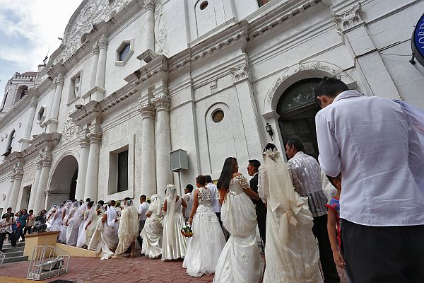 Couples prepare to say their “I dos” during a mass wedding in 2016. .