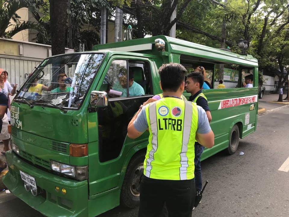 Members of the Land Transportation Franchising and Regulatory Board in Central Visayas or LTFRB-7 apprehend a jeeney driver in this file photo. Today, the LTFRB-7 will distribute cash assistance to jeepney operators here. | photo courtesy of LTFRB-7