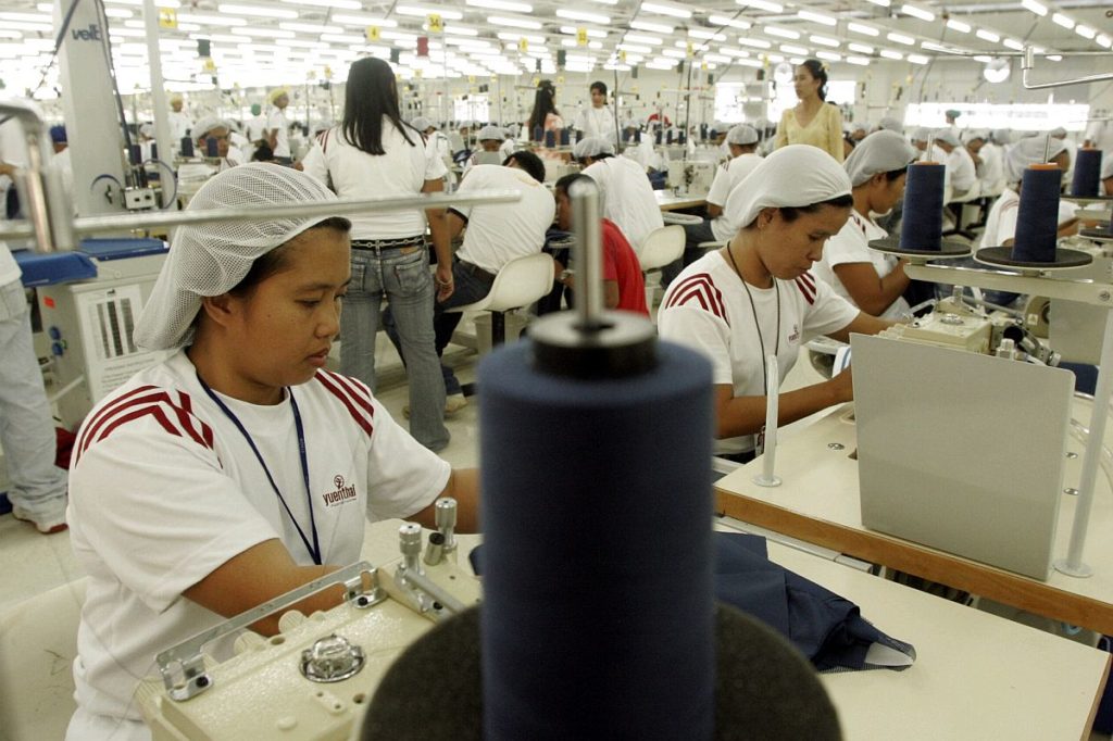 Businesses worry as wage hike set to be implemented. In photo are factory workers working in factory in Mactan.