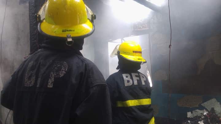 Firefighters of the Bureau of Fire Protection in Central Visayas (BFP-7) continue to put out a fire in Barangay Pahina Central in Cebu City in this January 3, 2019 photo. | CDN Digital file photo