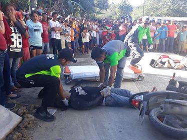 Scene of the Crime Operatives (Soco) personnel attend to a victim of a gun attack in Consolacion, Cebu on Friday afternoon, Feb. 22, 2019. |Photo courtesy of the Consolacion Police Station
