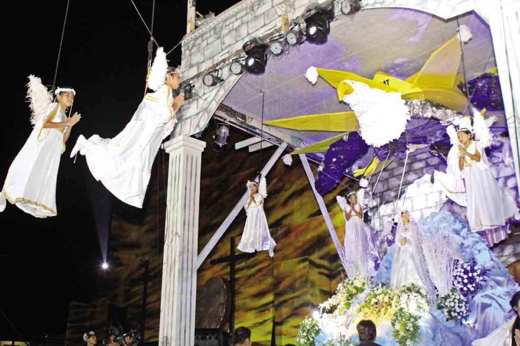 Children dressed as angles join Virgin Mary as she prepares to meet the resurrected Christ on Easter Sunday in this 2019 photo of Sugat sa Minglanilla..