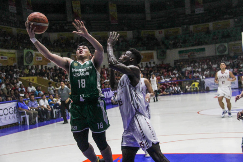 UV forward Jancork Cabahug attempts a shot against Lamine Thiam of SWU-Phinma in Game 1 of the Cesafi men's basketball finals at the Cebu Coliseum on November 18, 2019. CDN Digital photo | Jancork Cabahug (file photo)