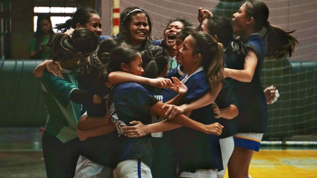 The Sacred Heart School-Ateneo de Cebu girls' futsal team celebrate.
