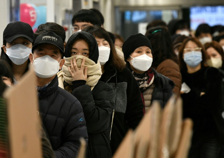 People in South Korea wearing surgical masks to prevent contracting COVID-19