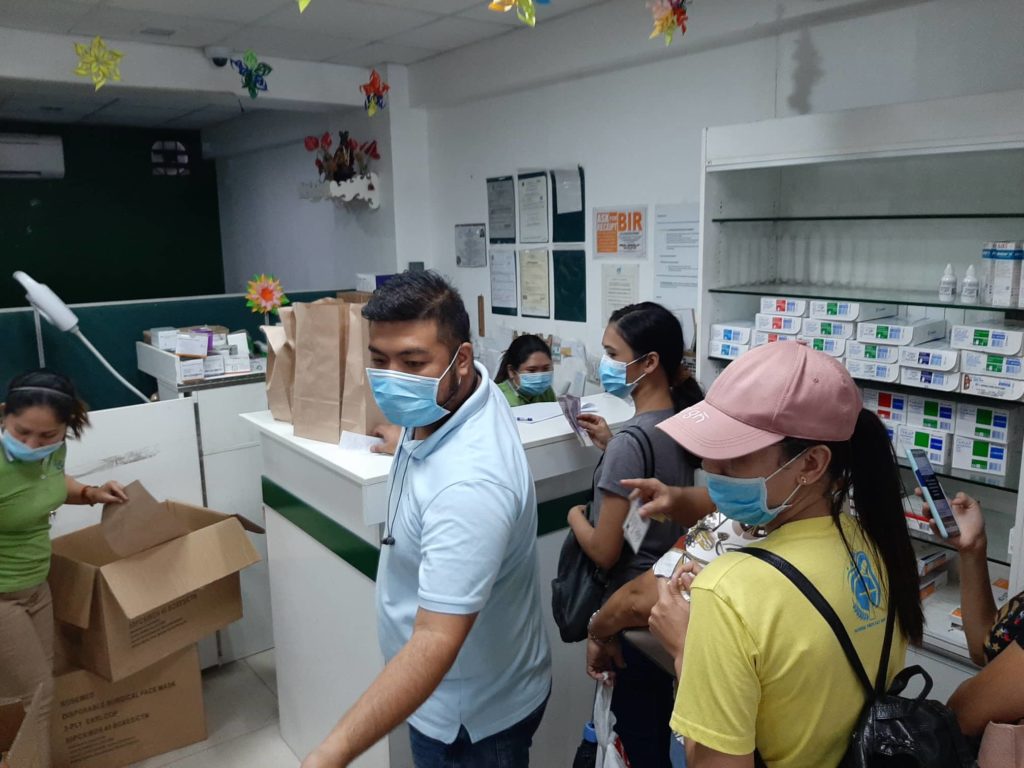 People wait for their turn to buy face masks in a Cebu City pharmacy in February 2020 at the start of the COVID-19 threat in the country. This month the city government also started a crackdown on establishments selling overpriced personal protective equipment products. | CDN Digital file photo