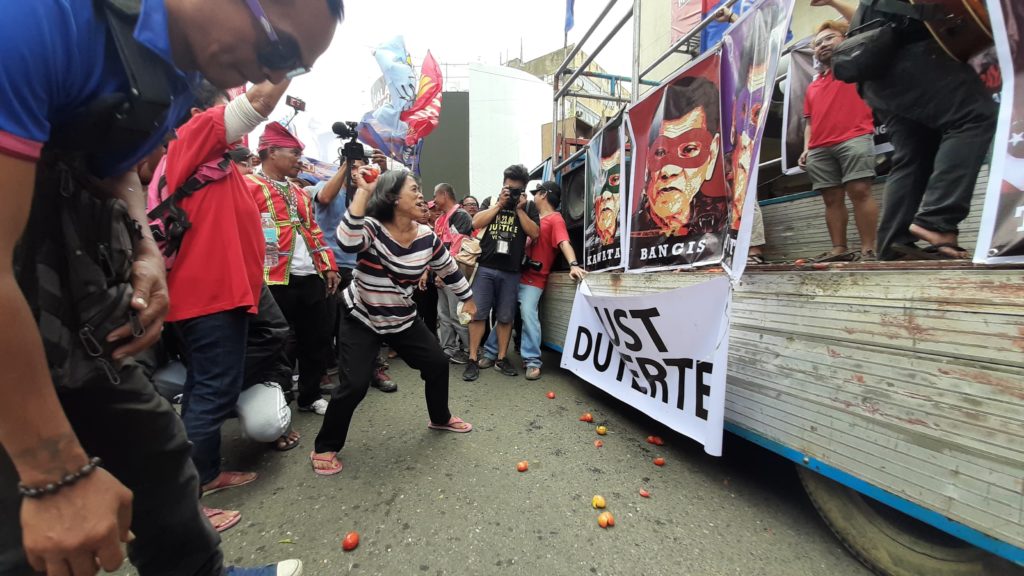 Tomatoes were thrown at posters of President Rodrigo Duterte during a protest organized by militant groups in here on Tuesday morning, February 25, 2020, to commemorate the 34th anniversary of the EDSA People Power Revolution. 
