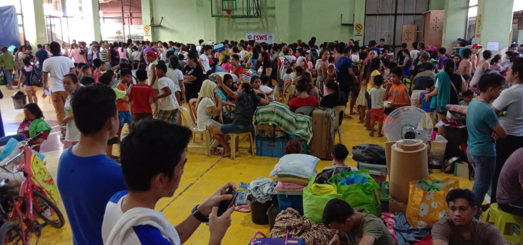 Barangay Ibabao-Estancia fire victims gather at the barangay gynmnasium.