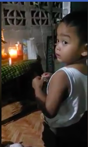 Three-year-old Airek Francesco Marquez leads the praying of the rosary in a prayer activity in San Francisco, Camotes Island, Cebu. | Screengrabbed from Marquez video
