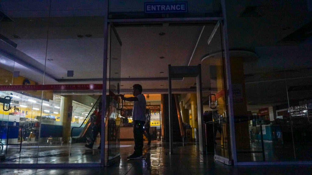 The first floor of the downtown Cebu City mall has no power after the firefighters put out the fastfood outlet fire on the third floor of the mall. | Gerard Francisco