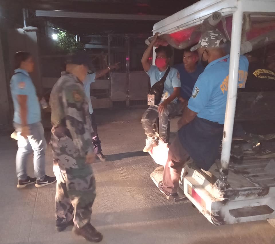 Lapu-Lapu City Police Office (LLCPO) personnel asks individuals caught on the street during the curfew hours to board the police mobile patrol and were brought to the police station. | Photo Courtesy of LLCPO