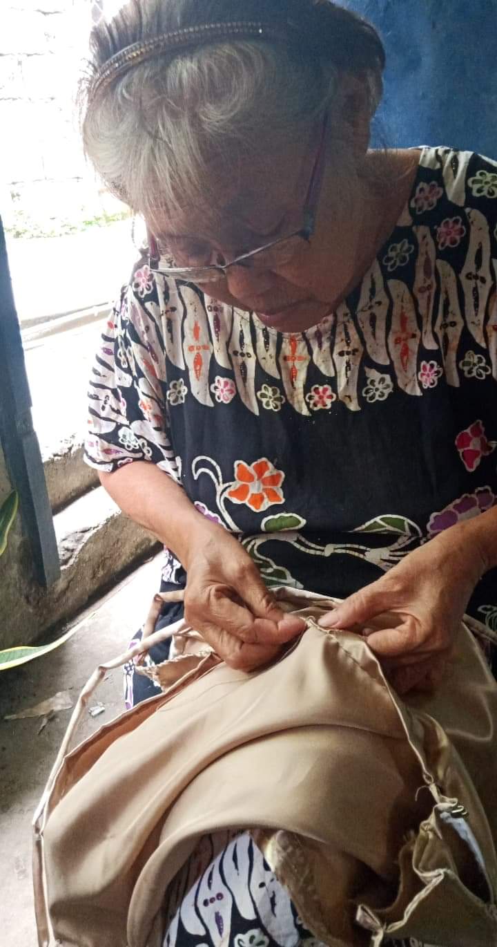 grandmother sewing prom dress