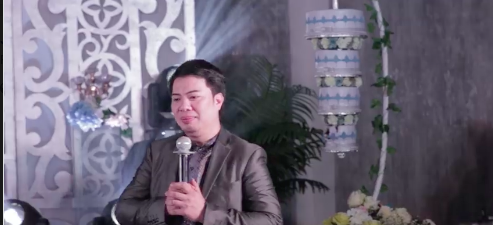 Vingenr Tan, an emcee or master of ceremony, does an A-1 job in his emceeing chores as he continues to put guests and newlyweds in stitches with his wit and humor during the wedding reception of a friend.| Screengrab from Medalle video