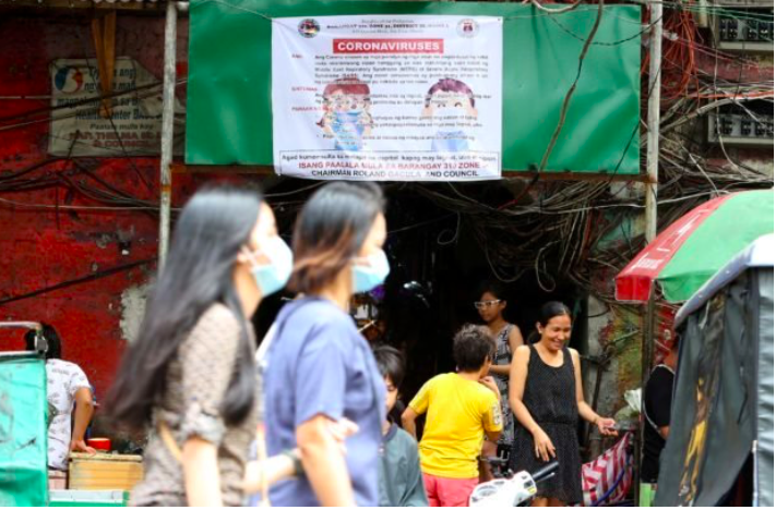 INFO DRIVE A tarpaulin about the Coronavirus Disease (COVID-19) has been put up by local officials in Barangay Sta. Cruz in Manila amid the virus scare in the country.| Inquirer photo | Marianne Bermudez