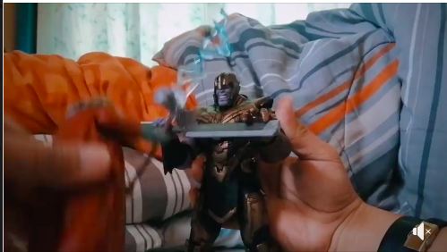 Thanos action figure ... reenacting Avengers movie scenes ...