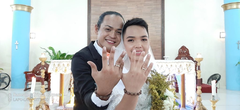 Jan Vincent “Nicole” Cutarra, 26, and Marry Jane (MJ) Degamo, 21, show their wedding bands after their wedding on March 7, 2020.| Contributed