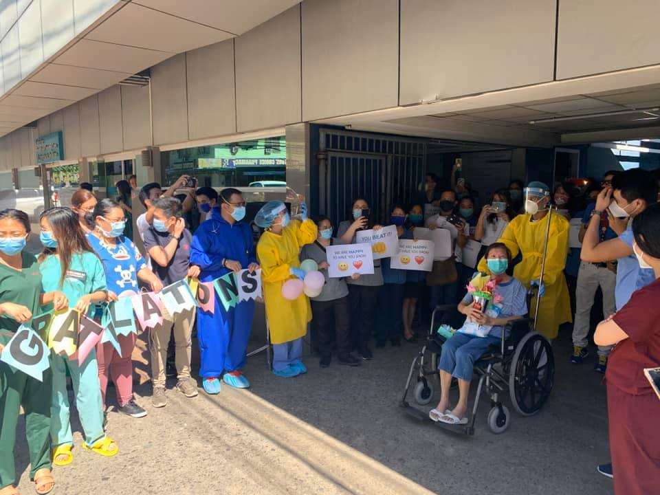 Staff from the Cebu Doctors’ Hospital in Cebu City greet their first patient who recovered from COVID-19, who happens to be one of their medical practitioners - internal medicine specialist Dr. Estrella Huang. | Photos by Dr. Yong Larrazabal III.