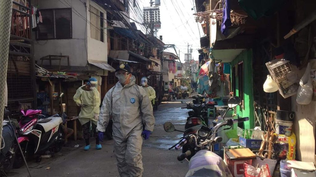 Police Colonel Josefino Ligan, chief of Cebu City Police Office (CCPO) together with Police Major Juanito Alaras of Mabolo Police station, conduct a foot patrol inside Sitio Zapatera, Barrio Luz, which was placed under a lockdown on Sunday, April 12, 2020 due to the two positive cases of coronavirus disease 2019 (COVID-19) in the area| Photo courtesy of CCPO