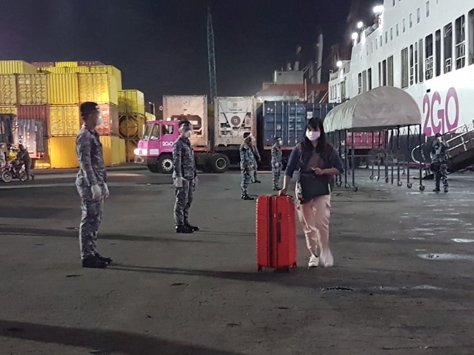 The 220 repatriated Cebuano OFWs started disembarking the ship past 4 a.m. on Tuesday, April 28. | Alven Marie Timtim