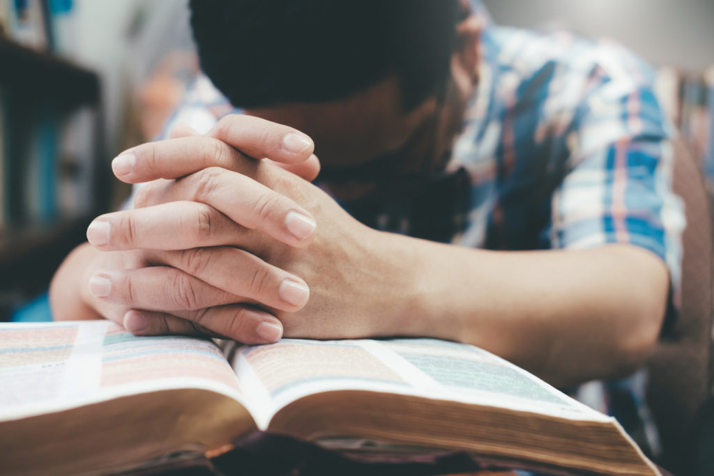 Prayer is a game-changer. In photo is a man praying. | Inquirer. net stock photo