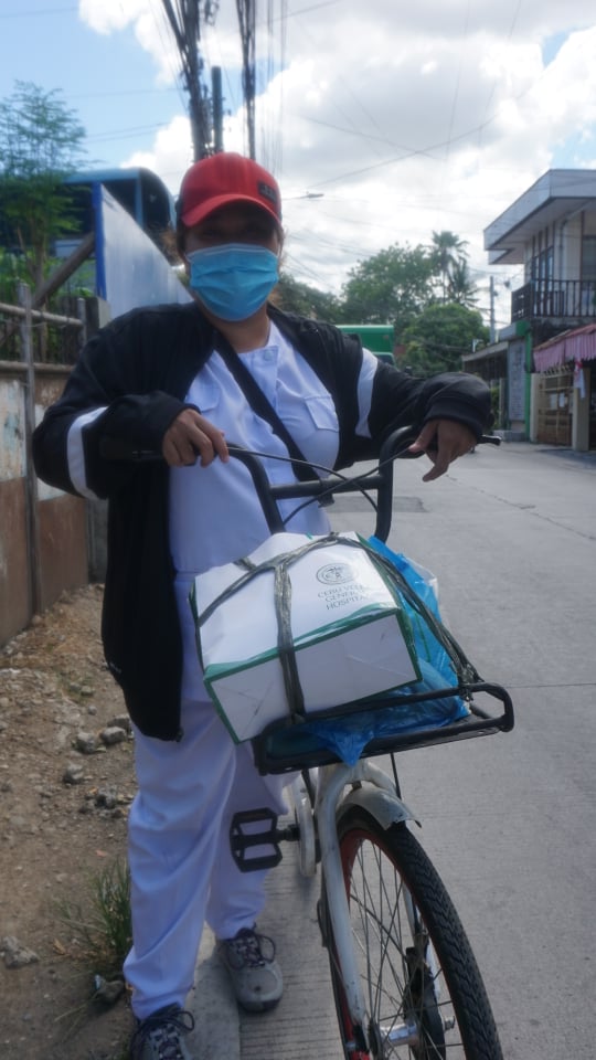 Ma. Elaine Juevesano, a nurse, rides a bike to work as her exercise and stress reliever from her work as a frontliner. | Gerard Francisco