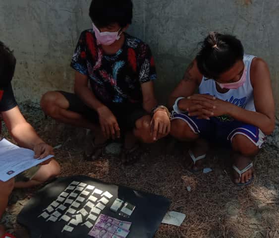 Rudy and Roland Fernandez are arrested during a buy-bust operation in Barangay Mactan, Lapu-Lapu City on April 24. | Norman V. Mendoza