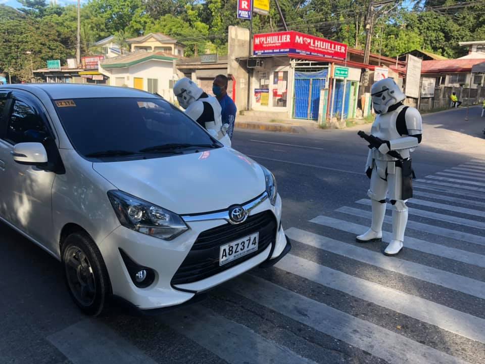 Stormtroopers of the 501st Cebu Scarif Garrison in Consolacion help man the checkpoint area and bringing smiles to motorists. | Star Wars Cebu
