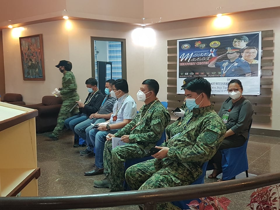 Cebu City Mayor Edgardo Labella (seated, middle wearing white) arrived at the Malasakit Recovery Center in Barangay Taptap, Cebu City this afternoon, May 29, 2020, to inspect the new isolation facility for the region's COVID-19 infected policemen. | CDND Photos