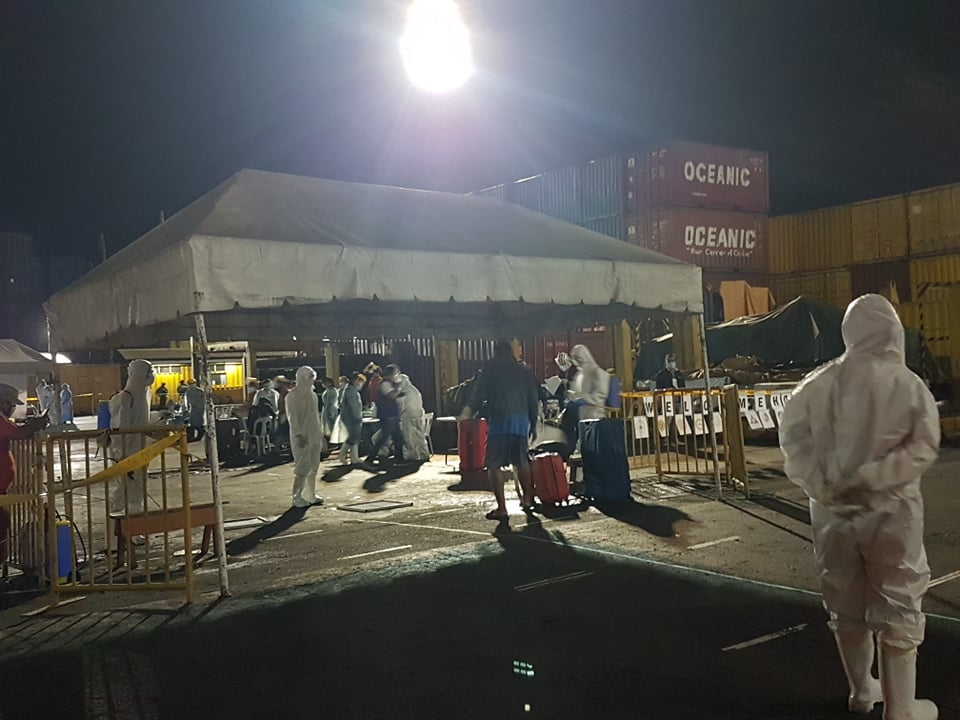 LOOK: Some of the repatriated overseas Filipino workers (OFW) start to disembark from the MV St. Michael The Archangel, the vessel that has brought them from Manila, where they have been stranded for about a month. The OFWs arrived early this morning (April 28, 2020) at Pier 6 of the Cebu City port. | Alven Marie A. Timtim and Rosalie O. Abatayo
