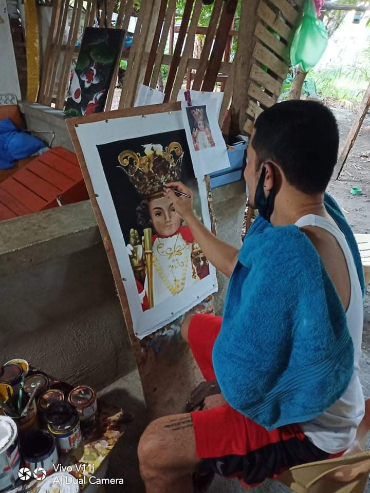 Michael Yurag, the artist from Medellin, says the Santo Niño painting that went viral online was done by him in three days.| Photo from: Municipality of Medellin Cebu.
