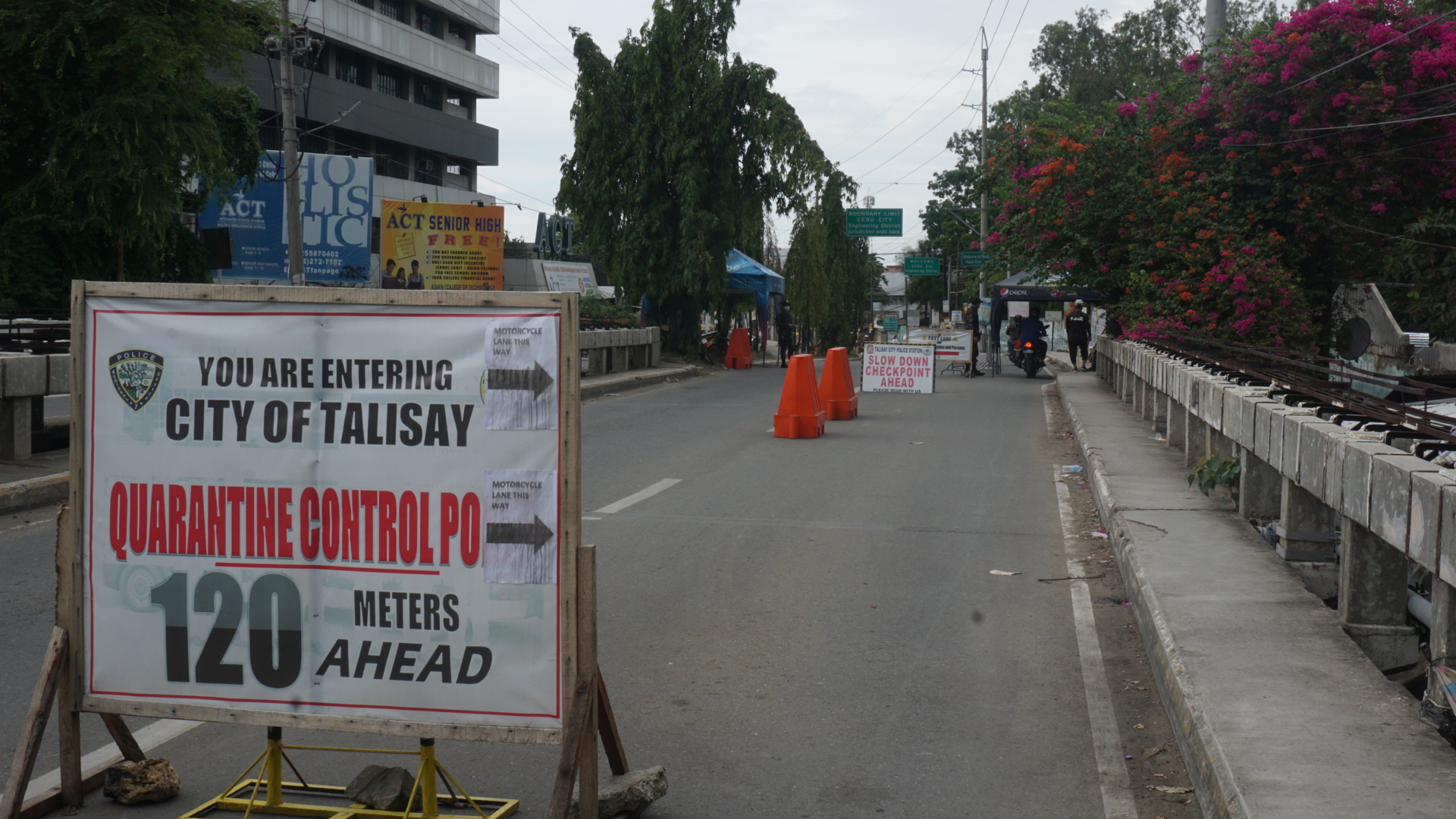 Police have set up a checkpoint at the border of Cebu City and Talisay City along the national highway in Barangay Bulacao on Thursday morning, June 18, 2020. | Gerard Vincent Francisco