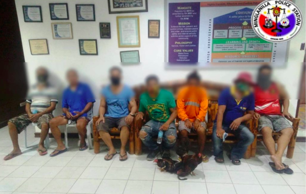 A public school teacher is arrested for trying to hide relatives pursued by police for illegal gambling. His two relatives and four other illegal gamblers and the school teacher are detained at the Minglanilla Police Station detention cell. | Photo courtesy of Minglanilla Police Station