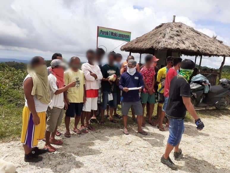 Fourteen men were caught engaging in illegal cockfighting also known as tigbakay on Sunday afternoon, July 19, 2020 in Purok 7 Maki-Angayon, Barangay Santicon, Badian town in southern Cebu.| Photo from 2ndPMFC