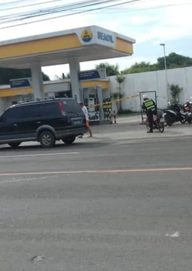 Police are investigating current and former employees of the gasoline station in Barangay Tuyan, Naga City that was robbed on Sunday. The robbers also killed the gasoline station's security guard.| Contributed Photo via Paul Lauro
