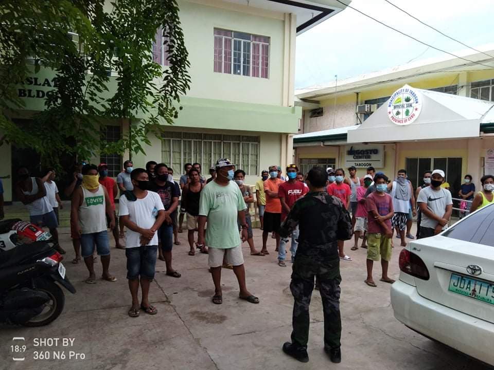 The First Provincial Mobile Force Company arrest 53 men caught engaging in illegal cockfighting activity or tigbakay on Saturday, June 29, 2020 in Sitio Esi, Barangay Kal-anan, Tabogon, Cebu.| CONTRIBUTED PHOTO — Police Lt. Col. Randy Korret