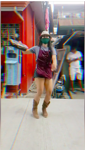 Patricia Kaye Cirujano, a performing artist, uses her dancing skills to catch her customer's attention for the family's food products in Barangay Tejero, Cebu City. | screen grab from her video