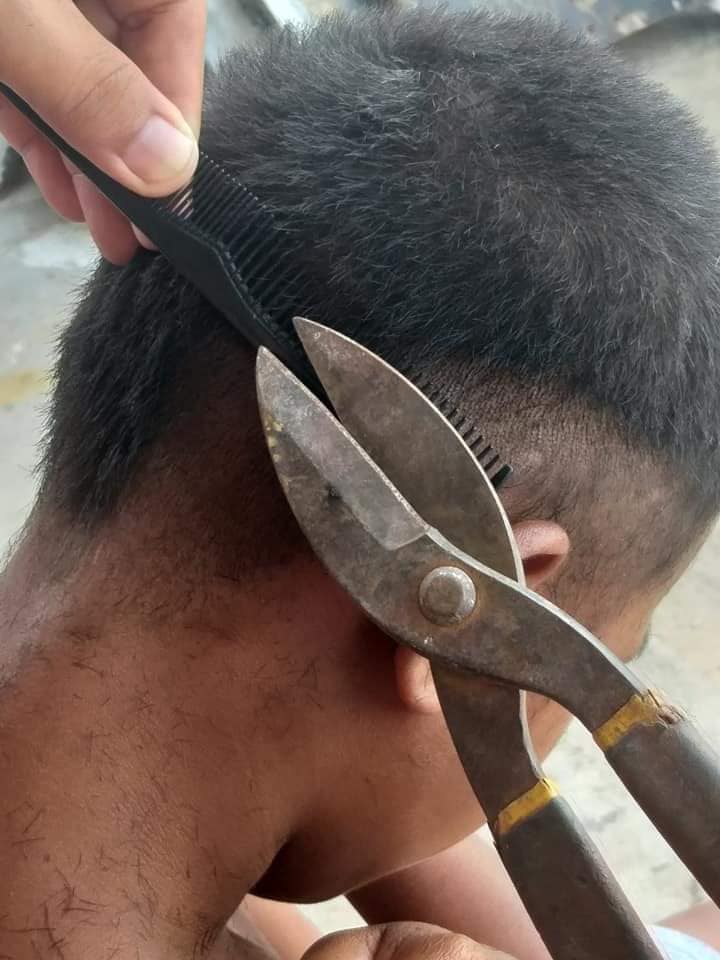 The Mantilla brothers have found a novel way to cut hair amid the pandemic -- using a steel cutter to cut one's hair. | Contributed photo.