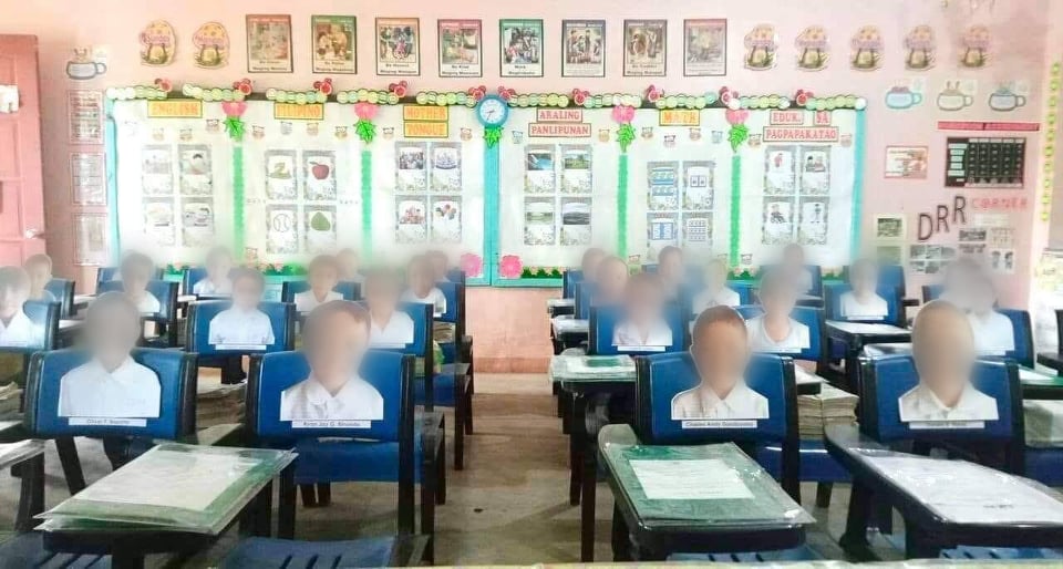 Pinky Donaire, who is a distance learning teacher and one of the teachers in this story, pastes pictures of his students on their school chairs so that she will feel that her students are there with her in the classroom. 