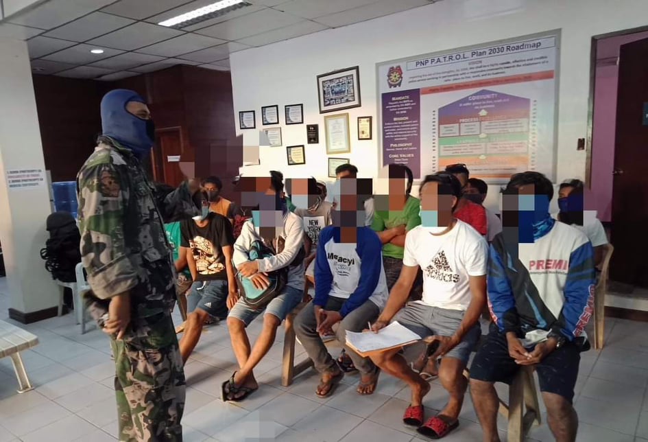 MINGLANILLA MGCQ VIOLATORS. About 60 individuals were arrested, detained at the police station and fined P500 for violating MGCQ protocols in Minglanilla town southern Cebu. | Photo Courtesy of PMSG Christopher Cesa
